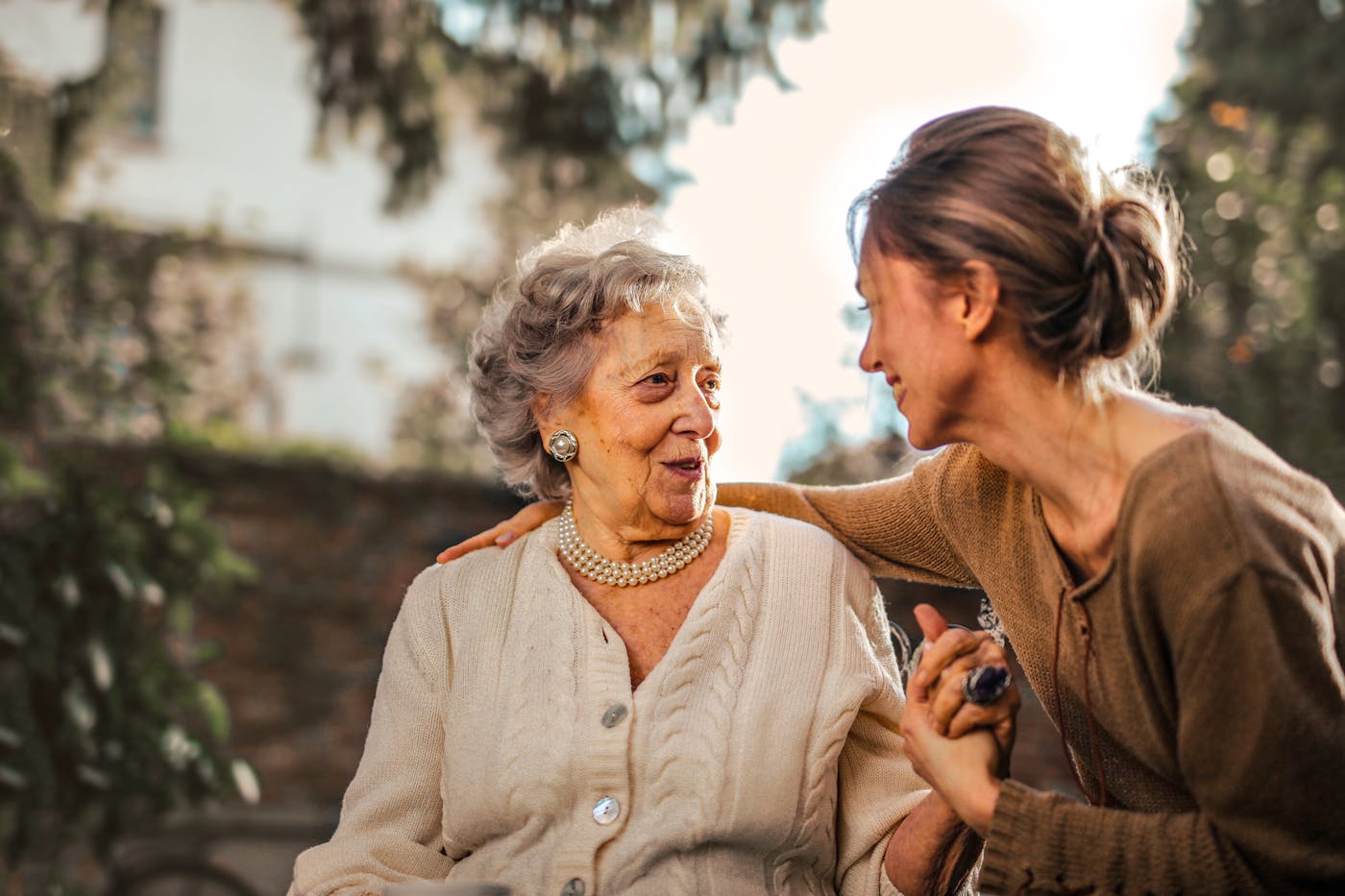 Senior mother sharing a warm moment with her adult daughter